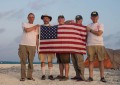 US team members with flag