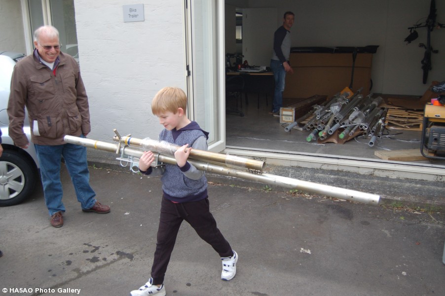 Gene observes Grandson Jaden help load antennas