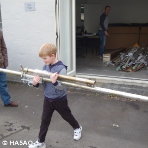 Gene observes Grandson Jaden help load antennas