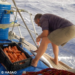 Ray removing the hook from a Baracudda he just caught to toss him back